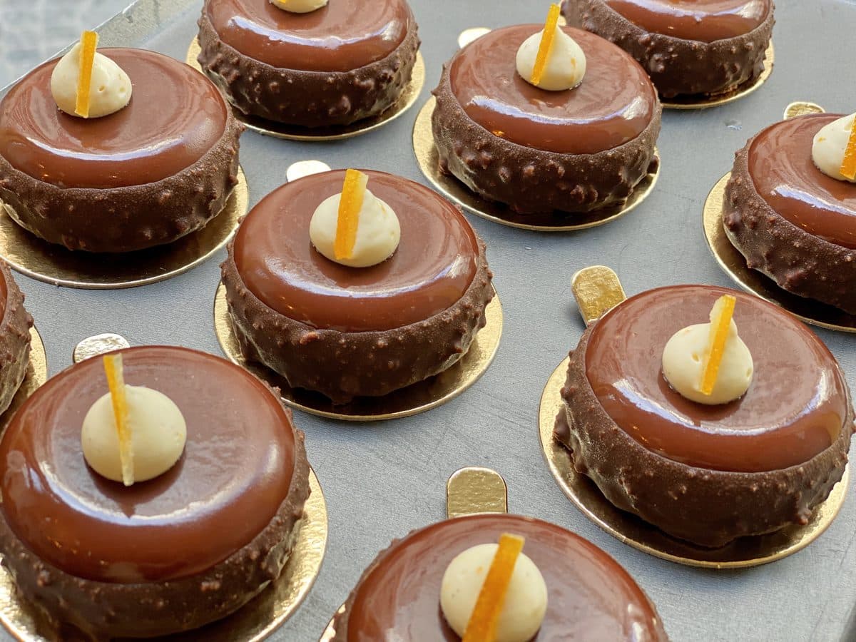 Tartelletta al Cioccolato — Dark chocolate ganache on a crisp shell, candied Sicilian orange peel.