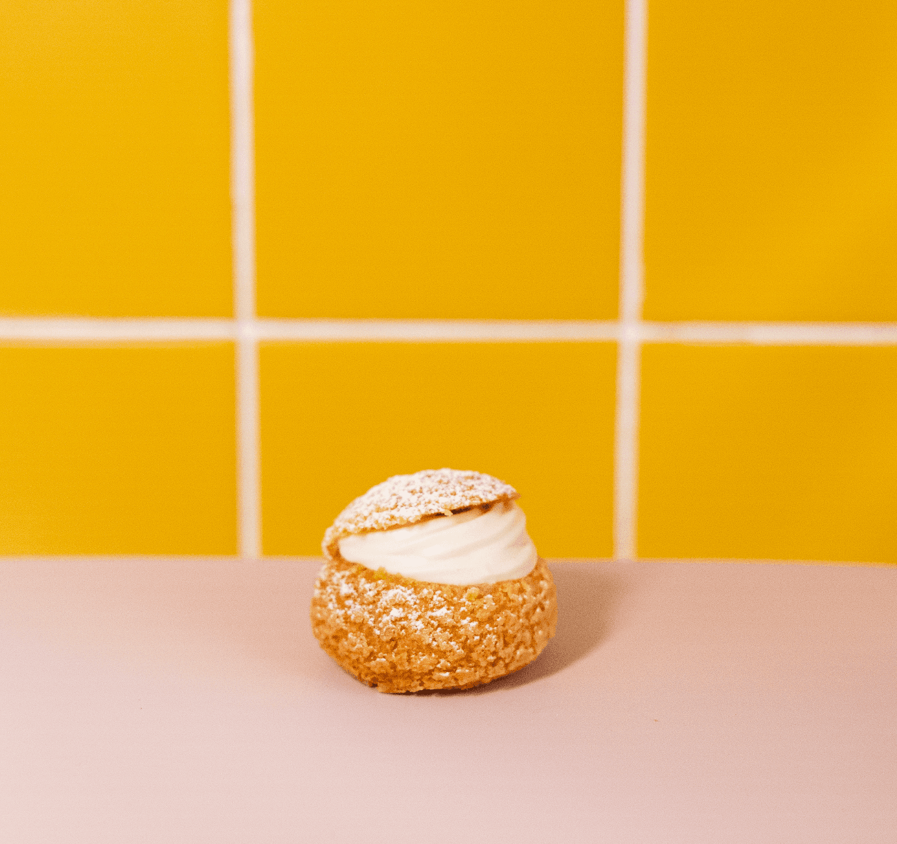 Soy and Apricot Bigné — A delicate choux pastry filled with light soy cream and bright apricot, balancing freshness with a soft, creamy finish. Elegant and a little unexpected in the best way.