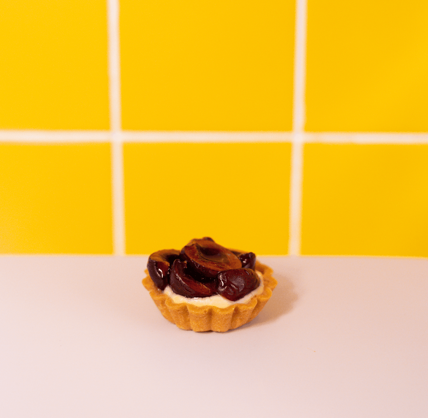 Crostatine di Frutta Stagionale — Fine tart shell, baked almond cream and creamy custard topped with fresh seasonal fruit.